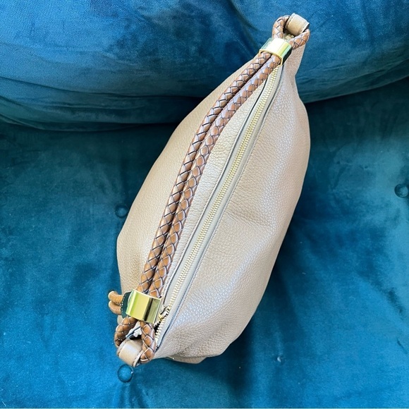 MICHAEL KORS COLLECTION
Skorpios Desert Tan Pebbled Leather Hobo
Bag $79… - Picture 6 of 16